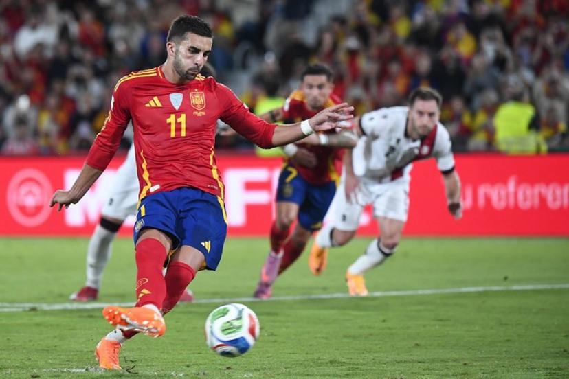 Spain's forward #11 Ferran Torres shoots from the penalty spot during the 2026 World Cup qualifier Europe zone group E football match between Spain and Georgia at Manuel Martinez Valero stadium in Elche on October 11, 2025.  Jose Jordan / AFP