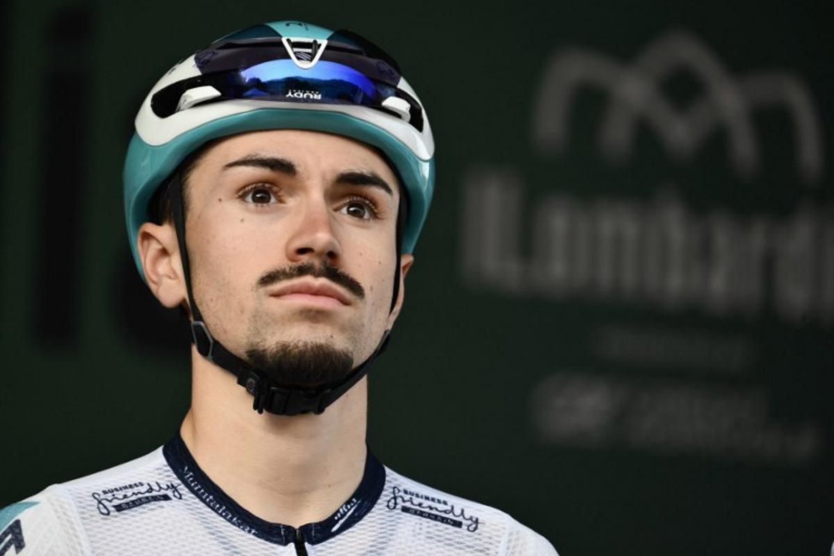Bahrain Victorious's French rider Lenny Martinez looks on from the sign-in podium ahead of the 119th edition of the Giro di Lombardia (Tour of Lombardy), a 238km cycling race from Como to Bergamo on October 11, 2025.  Marco BERTORELLO / AFP