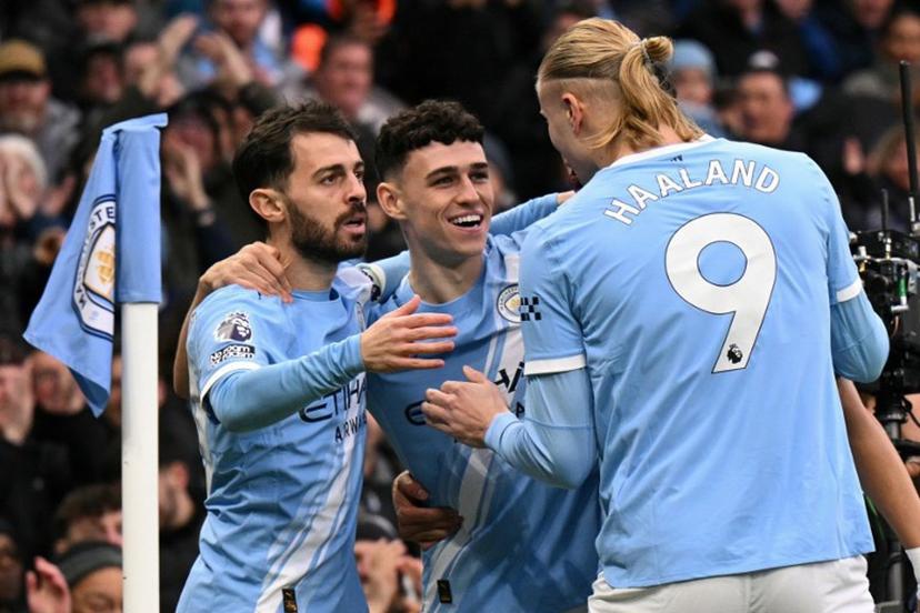 Manchester City's English midfielder #47 Phil Foden (C) celebrates scoring the opening goal during the English Premier League football match between Manchester City and Leeds United at the Etihad Stadium in Manchester, north west England, on November 29, 2025.  Oli SCARFF / AFP