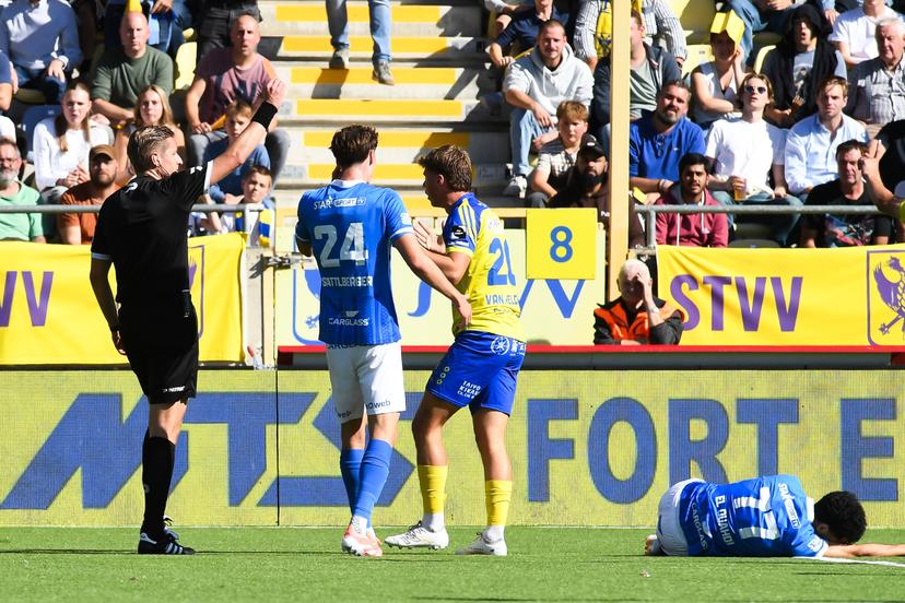 STVV's Rein Van Helden receives a red card from, referee Lawrence Visser and during a soccer match between Sint-Truidense V.V. and KRC Genk, Sunday 28 September 2025 in Sint-Truiden, on day 9 of the 2025-2026 'Jupiler Pro League' first division of the Belgian championship. BELGA PHOTO JILL DELSAUX