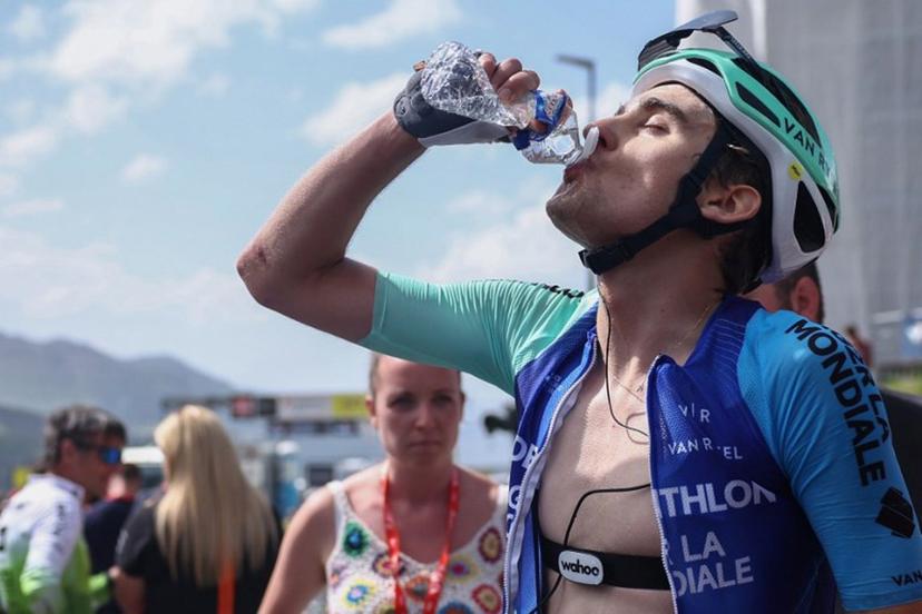 Decathlon AG2R La Mondiale Team's French rider Paul Seixas drinks from a bottle at the end of the 7th stage of the 77th edition of the Criterium du Dauphine cycling race, 131,6 km between Grand-Aigueblanche and Valmeinier, on June 14, 2025.  Anne-Christine POUJOULAT / AFP