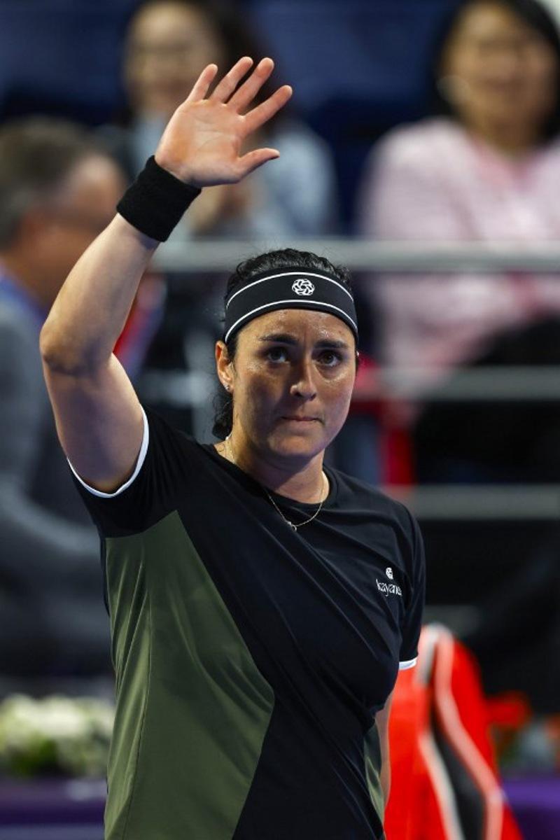 Ons Jabeur of Tunisia greets supporters after winning against McCartney Kessler of the USA during their 2025 WTA Qatar Open match at the Khalifa International Tennis Complex in Doha on February 10, 2025.  KARIM JAAFAR / AFP
