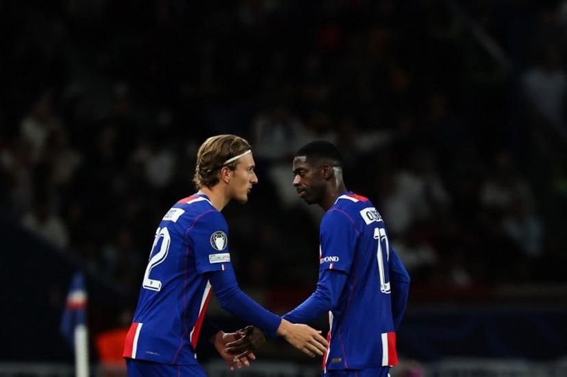 Paris Saint-Germain's French forward #10 Ousmane Dembele (R) leaves the pitch as he is replaced by Paris Saint-Germain's Belgian forward #22 Mika Godts during the UEFA Champions League, league phase, matchday 1, football match between Paris Saint-Germain (PSG) and Slovan Bratislava at the Parc des Princes Stadium in Paris on September 9, 2026.  Anne-Christine POUJOULAT / AFP