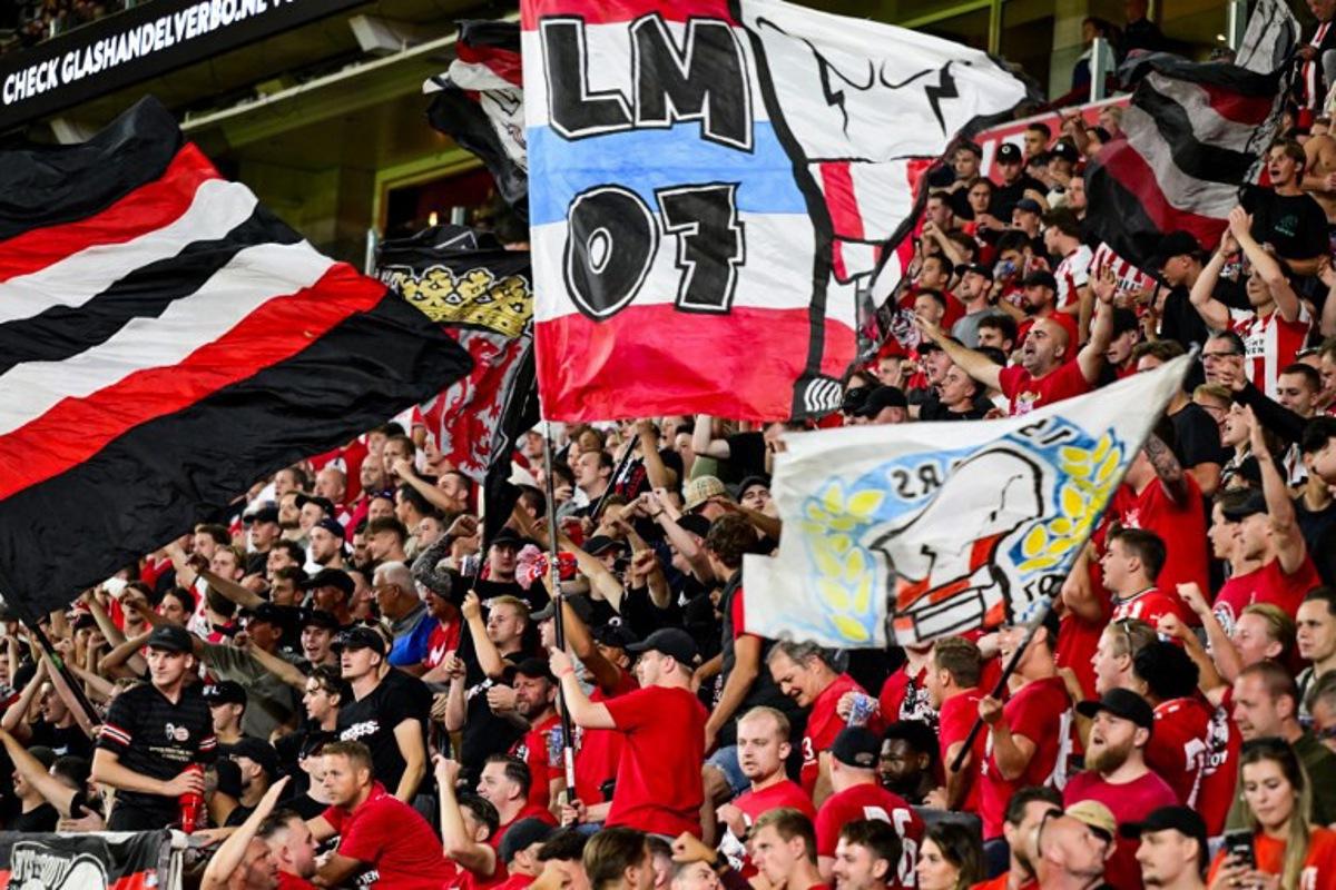 PSV fans cheer their team on from the stands during the the Dutch Eredivisie match between PSV Eindhoven and Sparta Rotterdam at the Phillips Stadium in Eindhoven on August 9, 2025.  Olaf Kraak / ANP / AFP