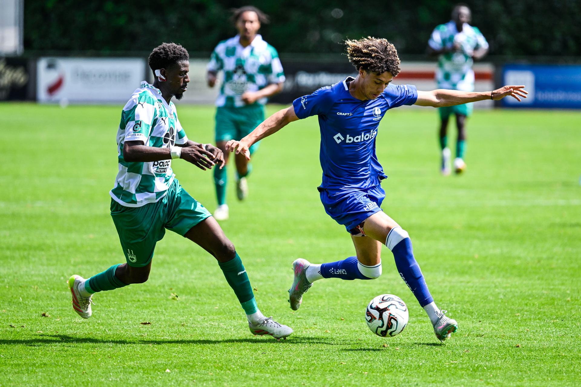 RAAL's Jordi Baininwa Liongola and Gent's Franck Surdez pictured in action during a friendly soccer game between Belgian soccer team KAA Gent and RAAL La Louviere, on Saturday 12 July 2025 in Horst, The Netherlands. The team is preparing for the upcoming 2025-2026 first division season. BELGA PHOTO TOM GOYVAERTS
