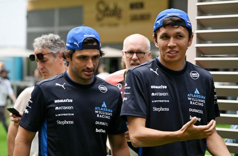 Williams' Spanish driver Carlos Sainz, Jr. (L), and teammate Thai driver Alexander Albon arrive ahead of the practice session for the 2025 Miami Formula One Grand Prix at Miami International Autodrome in Miami Gardens, Florida, on May 2, 2025.   Chandan Khanna / AFP