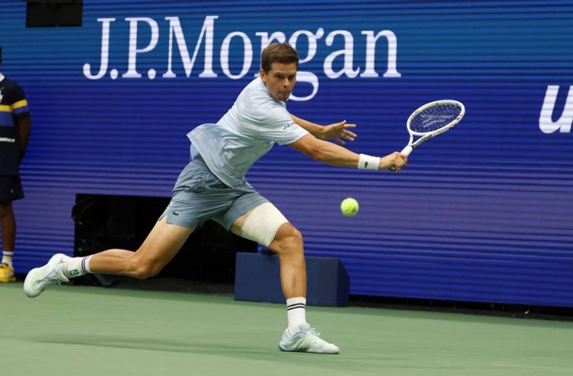 Belgium's Alexander Blockx returns the ball to Russia's Karen Khachanov during the men's singles quarter-final tennis match on day eleven of the US Open tennis tournament at the USTA Billie Jean King National Tennis Center in New York City on September 9, 2026.  TIMOTHY A. CLARY / AFP