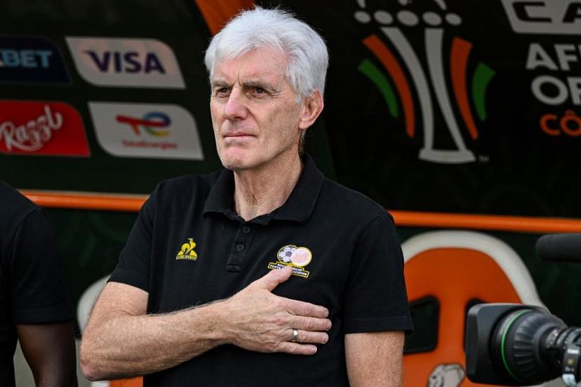 South Africa's head coach Hugo Broos gestures during the national anthem ahead of the Africa Cup of Nations (CAN) 2024 semi-final football match between Nigeria and South Africa at the Stade de la Paix in Bouake on February 7, 2024.  Issouf SANOGO / AFP