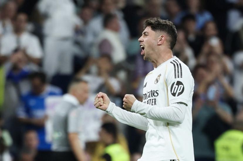 Real Madrid's Uruguayan midfielder #08 Federico Valverde celebrates scoring his team's first goal during the Spanish league football match between Real Madrid CF and Girona FC at the Santiago Bernabeu stadium in Madrid on April 10, 2026.  Thomas COEX / AFP