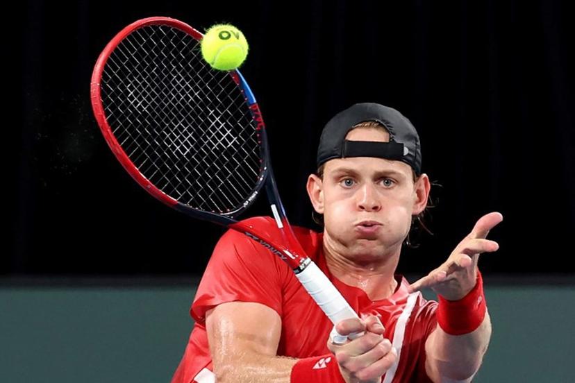 Belgium's Zizou Bergs hits a return to Australia's Alex de Minaur during the Davis Cup second-round qualifier tennis match at Ken Rosewall Arena in Sydney on September 14, 2025.  DAVID GRAY / AFP