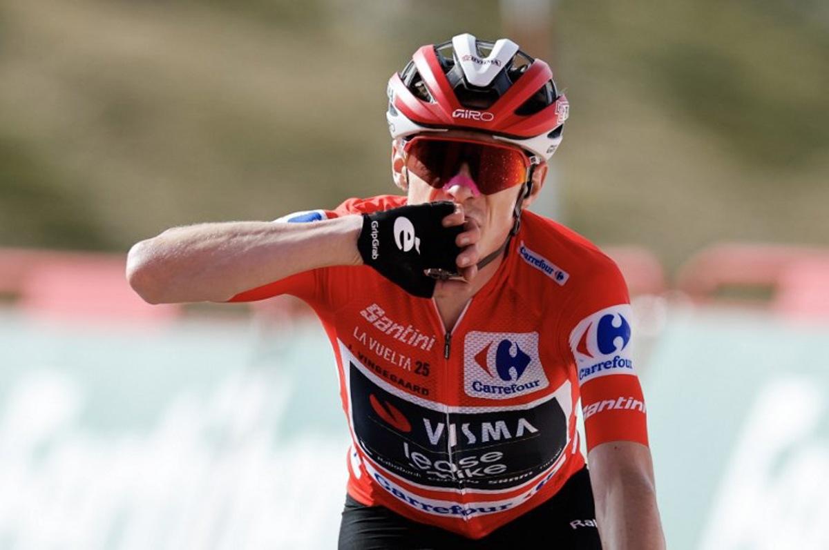 (FILES) Overall leader team Visma-Lease a bike's Danish rider Jonas Vingegaard celebrates winning the 20th stage of the Vuelta a Espana 2025, a 156 km race between Robledo de Chavela and Bola del Mundo, near Navacerrada, on September 13, 2025.   The final stage of the Vuelta a Espana was abandoned on September 14, 2025 because of huge pro-Palestinian protests in Madrid, with Jonas Vingegaard crowned champion for the first time. The race's overall leader crossed first the finish line on the Bola del Mundo mountain the day before, which effectively sealed his victory in the Vuelta a Espana 2025. Oscar DEL POZO / AFP
