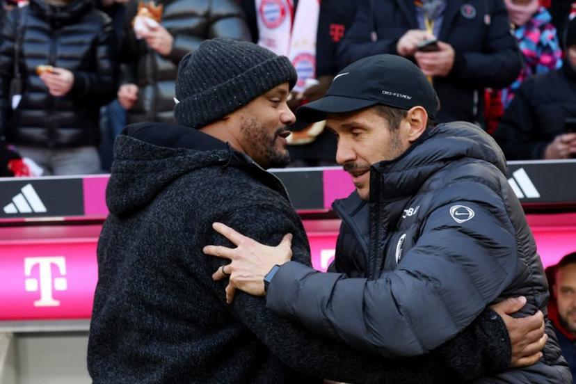 Bayern Munich's Belgian head coach Vincent Kompany (L) greets Freiburg's German head coach Julian Schuster prior to the German first division Bundesliga football match between FC Bayern Munich and SC Freiburg in Munich, southern Germany on November 22, 2025.  Karl-Josef HILDENBRAND / AFP