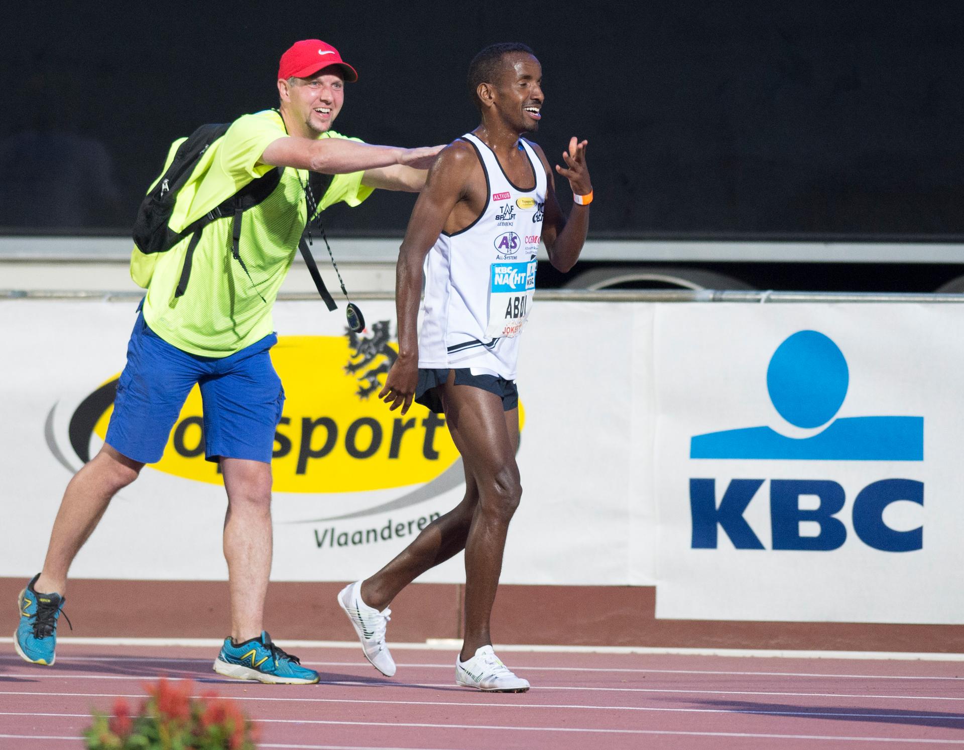 20150718 - HEUSDEN-ZOLDER, BELGIUM: Peter Robbens and Belgian Bashir Abdi pictured after the men's 5000m at the 13th edition of the 'KBC Nacht' athletics meeting, Saturday 18 July 2015, in Heusden-Zolder. Abdi qualified for the World Championships in Beijing. BELGA PHOTO JASPER JACOBS