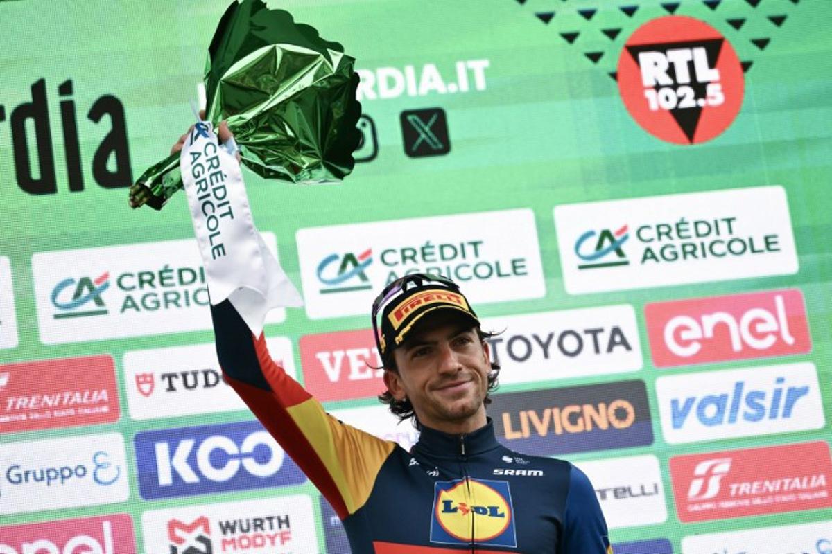 Lidl - Trek team's Italian rider Giulio Ciccone celebrates his third place on the podium after the 118th edition of the Giro di Lombardia (Tour of Lombardy), a 252km cycling race from Bergamo to Como on October 12, 2024.  Marco BERTORELLO / AFP