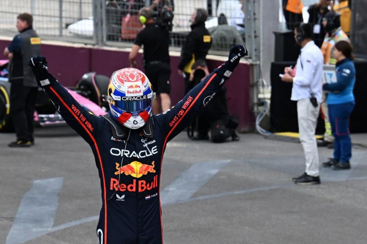 Red Bull Racing's Dutch driver Max Verstappen celebrates in the parc ferme after winning the Formula One Azerbaijan Grand Prix at the Baku City Circuit in Baku on September 21, 2025.   Ozan KOSE / AFP