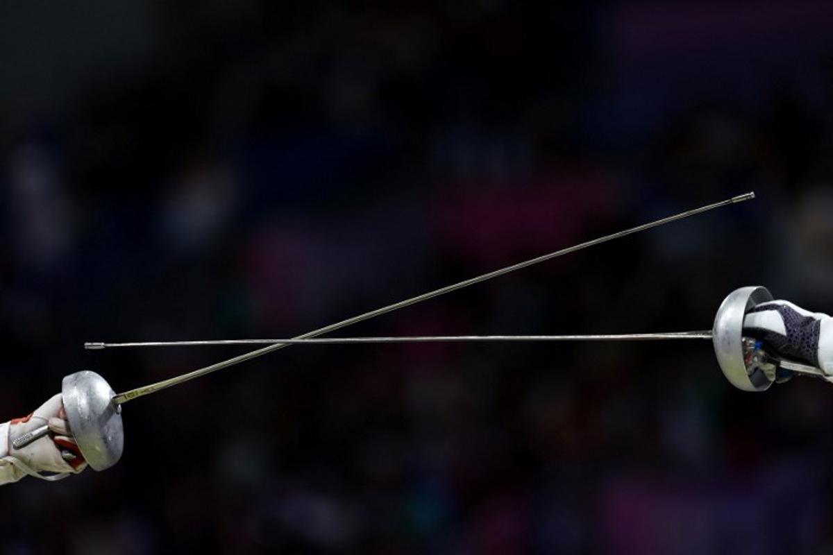 Fencers compete in the women's epee individual round of 32 bout during the Paris 2024 Olympic Games at the Grand Palais in Paris, on July 27, 2024.  FRANCK FIFE / AFP