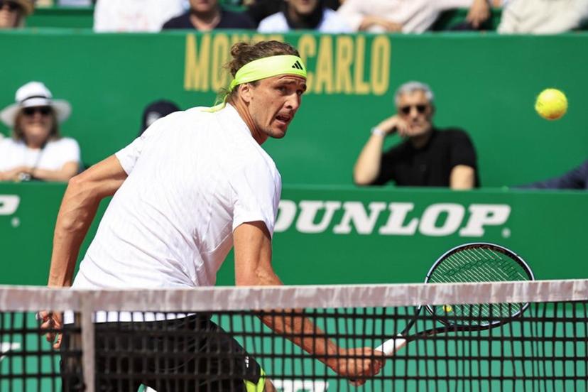 Germany's Alexander Zverev returns the ball to Italy's Matteo Berrettini during the Monte Carlo ATP Masters Series Tournament round of 32 tennis match on the Rainier III court at the Monte Carlo Country Club in Roquebrune-Cap-Martin on April 8, 2025.  Valery HACHE / AFP
