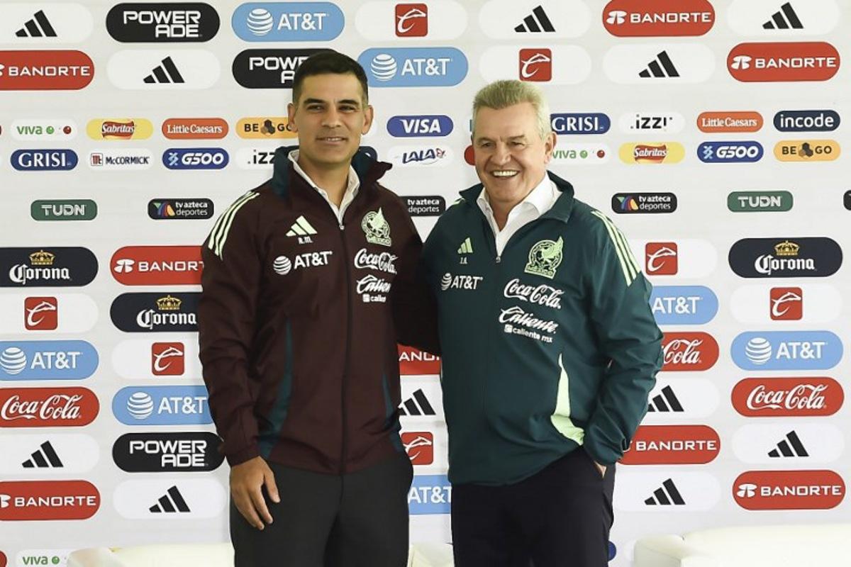 The new assistant coach, Rafael Marquez (L), and the new head coach, Javier Aguirre, pose for a picture during the presentation of the new technical staff for the Mexico National football team at the Centro de Alto Rendimiento in Mexico City on August 1, 2024.  Rodrigo Oropeza / AFP