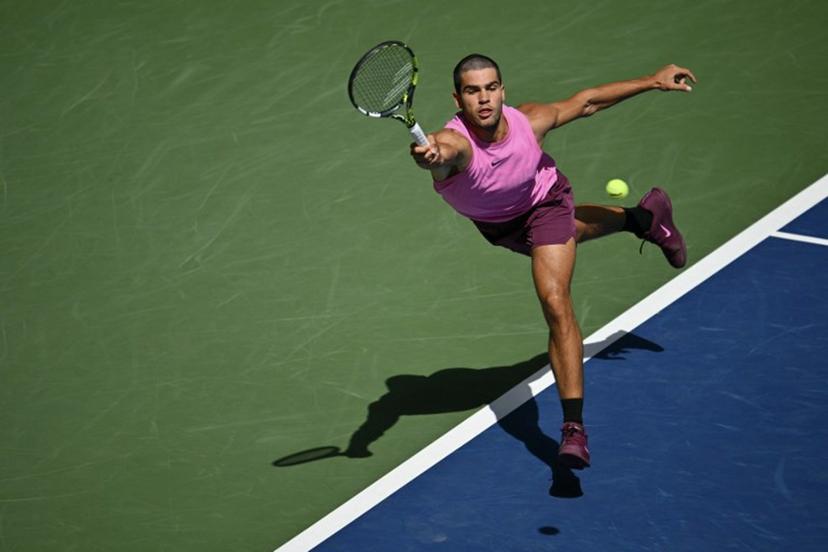 Spain's Carlos Alcaraz hits a return to France's Arthur Rinderknech during their men's singles round of 16 tennis match on day eight of the US Open tennis tournament at the USTA Billie Jean King National Tennis Center in New York City, on August 31, 2025.  ANGELA WEISS / AFP