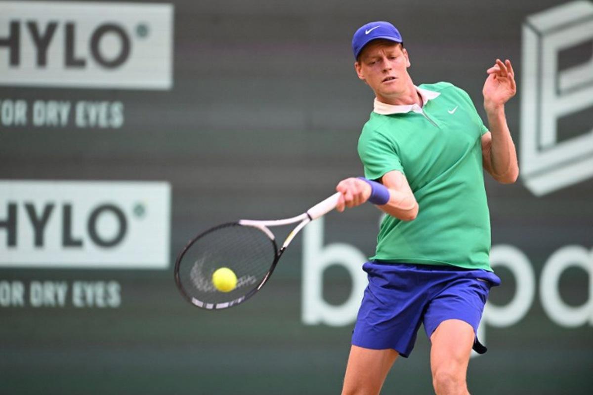 Kazakhstan's Alexander Bublik plays the ball to Italy's Jannik Sinner in their men's singles tennis match during the Halle Open ATP tennis tournament in Halle, on June 19, 2025.  CARMEN JASPERSEN / AFP