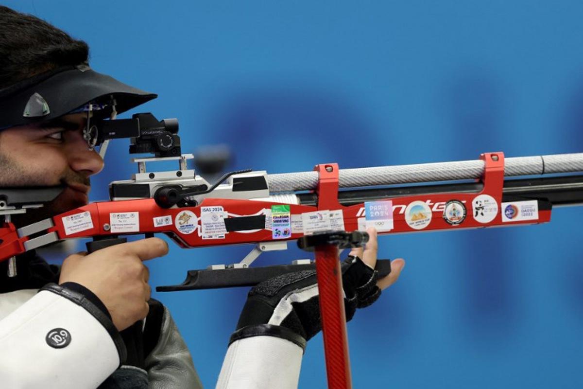 India's Arjun Babuta competes in the shooting 10m air rifle men's final during the Paris 2024 Olympic Games at Chateauroux Shooting Centre on July 29, 2024.  Alain JOCARD / AFP