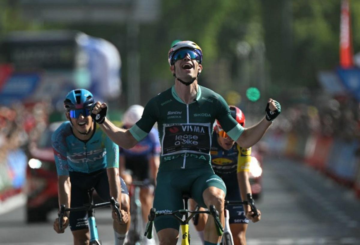 Team Visma-Lease a bike's Belgian rider Wout van Aert celebrates winning the 15th stage of the Vuelta a Espana 2026 cycling tour, a 110,2 km race which was modified from the original itinerary of 189,7 km following the activation of the high temperature protocal, between Palma del Rio and Cordoba, on September 6, 2026.   JORGE GUERRERO / AFP