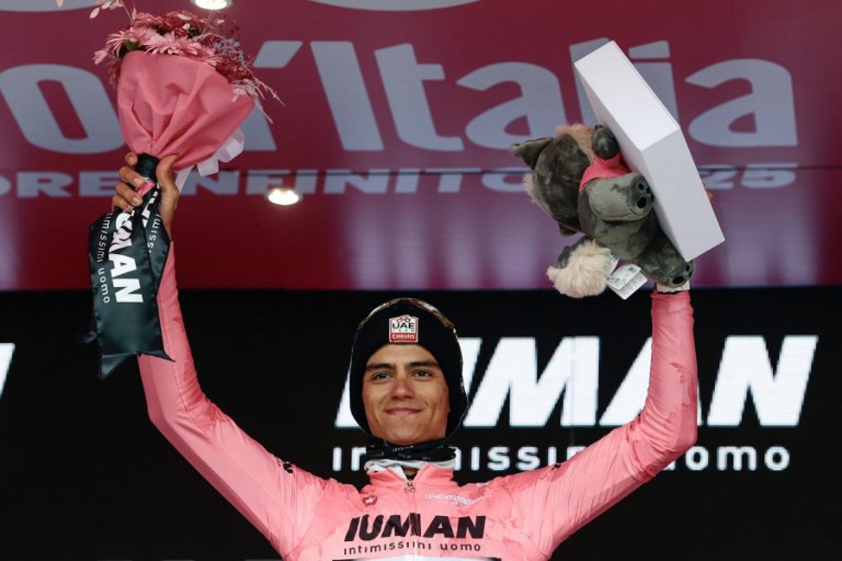 UAE Team Emirates XRG's Mexican rider Isaac Del Toro wearing the pink jersey of overall leader (Maglia Rosa) celebrates on the podium after the 14th stage of the 108th Giro d'Italia cycling race of 195kms from Treviso in Italy to Nova Gorica in Slovenia on May 24, 2025.  Luca Bettini / AFP