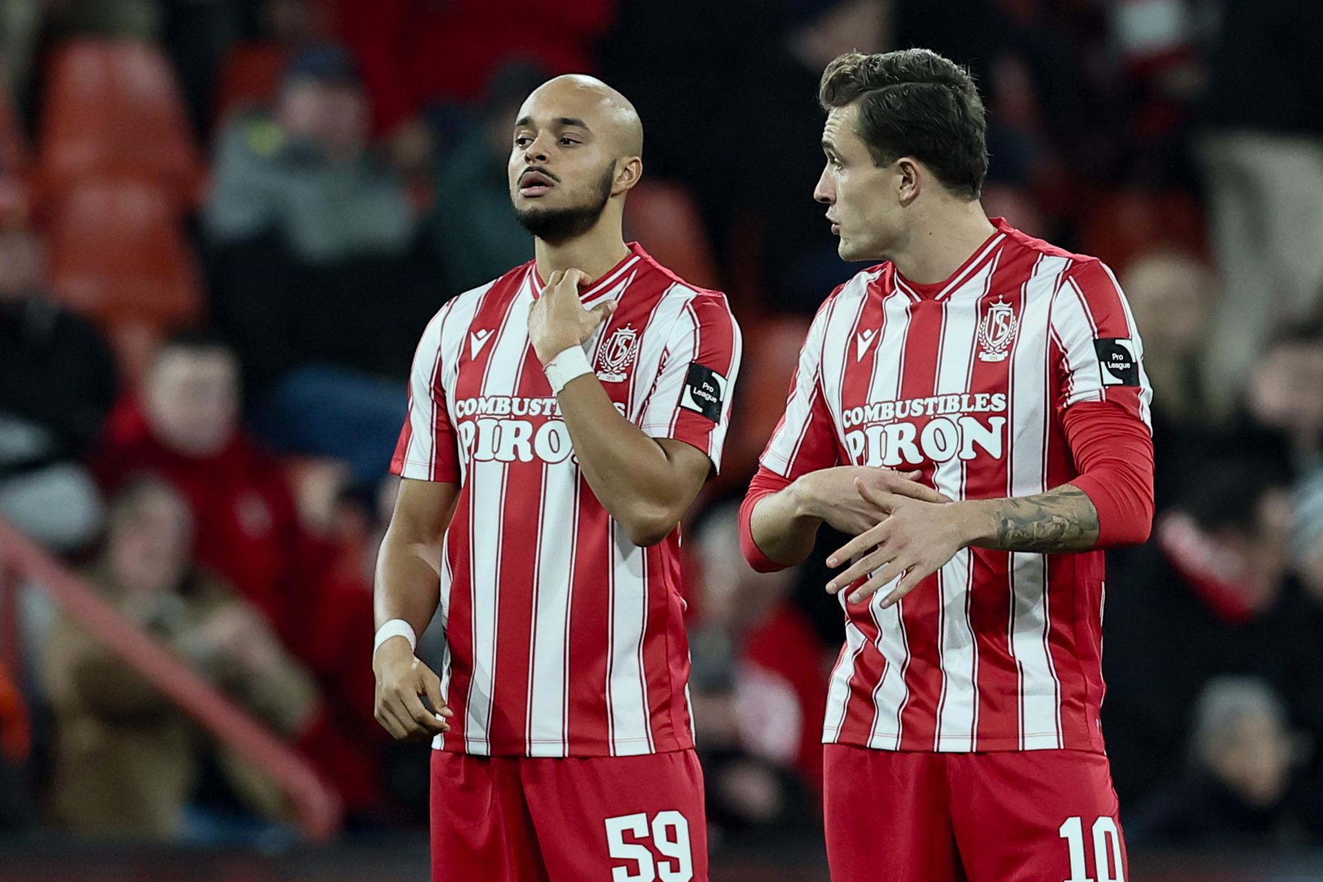 Standard's Timothe Nkada and Standard's Dennis Ayensa pictured at the start of a soccer match between Standard de Liege and Oud-Heverlee Leuven, Friday 12 December 2025 in Liege, on day 17 of the 2025-2026 'Jupiler Pro League' first division of the Belgian championship. BELGA PHOTO BRUNO FAHY