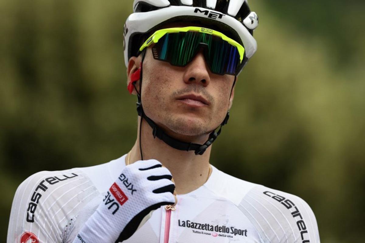 UAE Team Emirates XRG's Spanish rider Juan Ayuso waits for the start of the 9th stage of the 108th Giro d'Italia cycling race of 181kms from Gubbio to Siena on May 18, 2025.  Luca Bettini / AFP