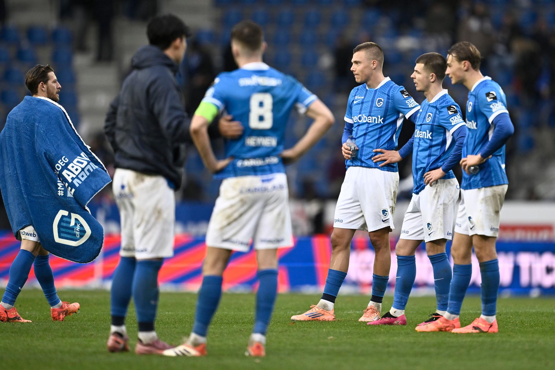 Genk's Daan Heymans, Genk's Jarne Steuckers and Genk's Matte Smets look dejected after losing a soccer match between KRC Genk and KV Mechelen, Sunday 23 November 2025 in Genk, a game of day 15 of the 2025-2026 'Jupiler Pro League' first division of the Belgian championship. BELGA PHOTO JOHAN EYCKENS