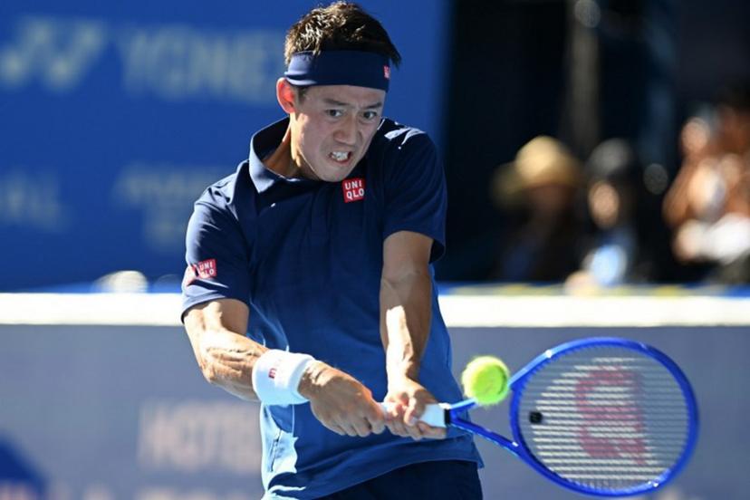 Japan's Kei Nishikori plays a shot to USA's Frances Tiafoe during their men's singles tennis match at the ATP Tour Japan Open Tennis Championships at the Ariake Tennis Forest Park in Tokyo on October 1, 2026.  Rie KIKUCHI / AFP
