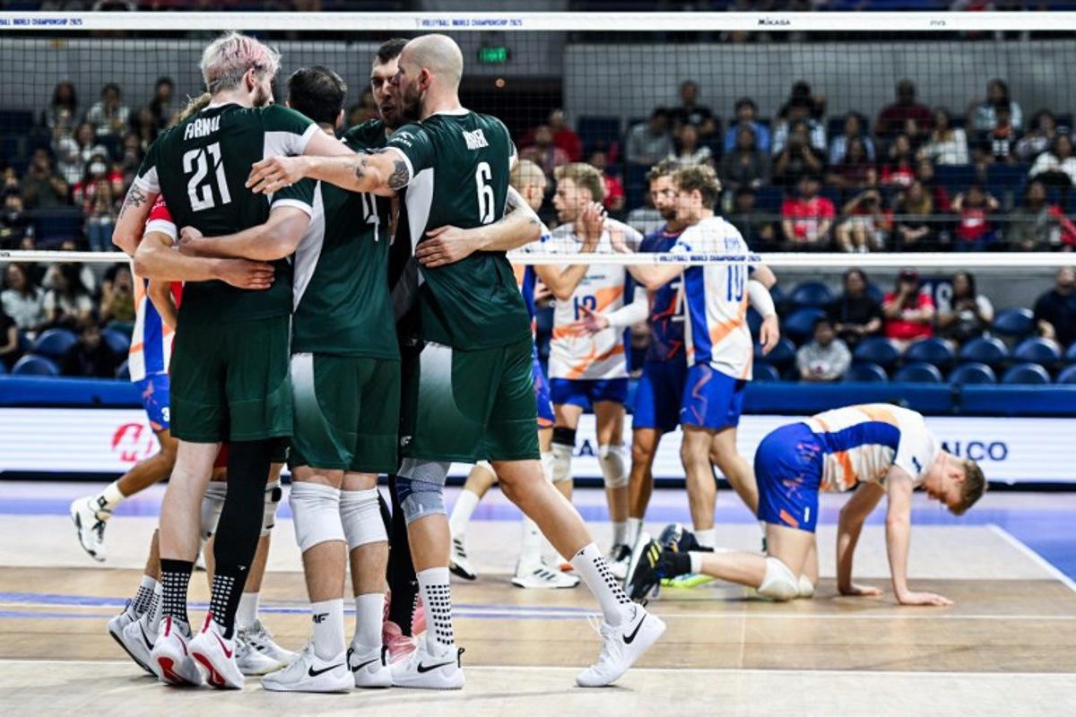 Team Poland celebrates after scoring a point against Netherlands during the 2025 Men's Volleyball World Championship at the Araneta Coliseum in Quezon City on September 17, 2025.  SHERWIN VARDELEON / AFP