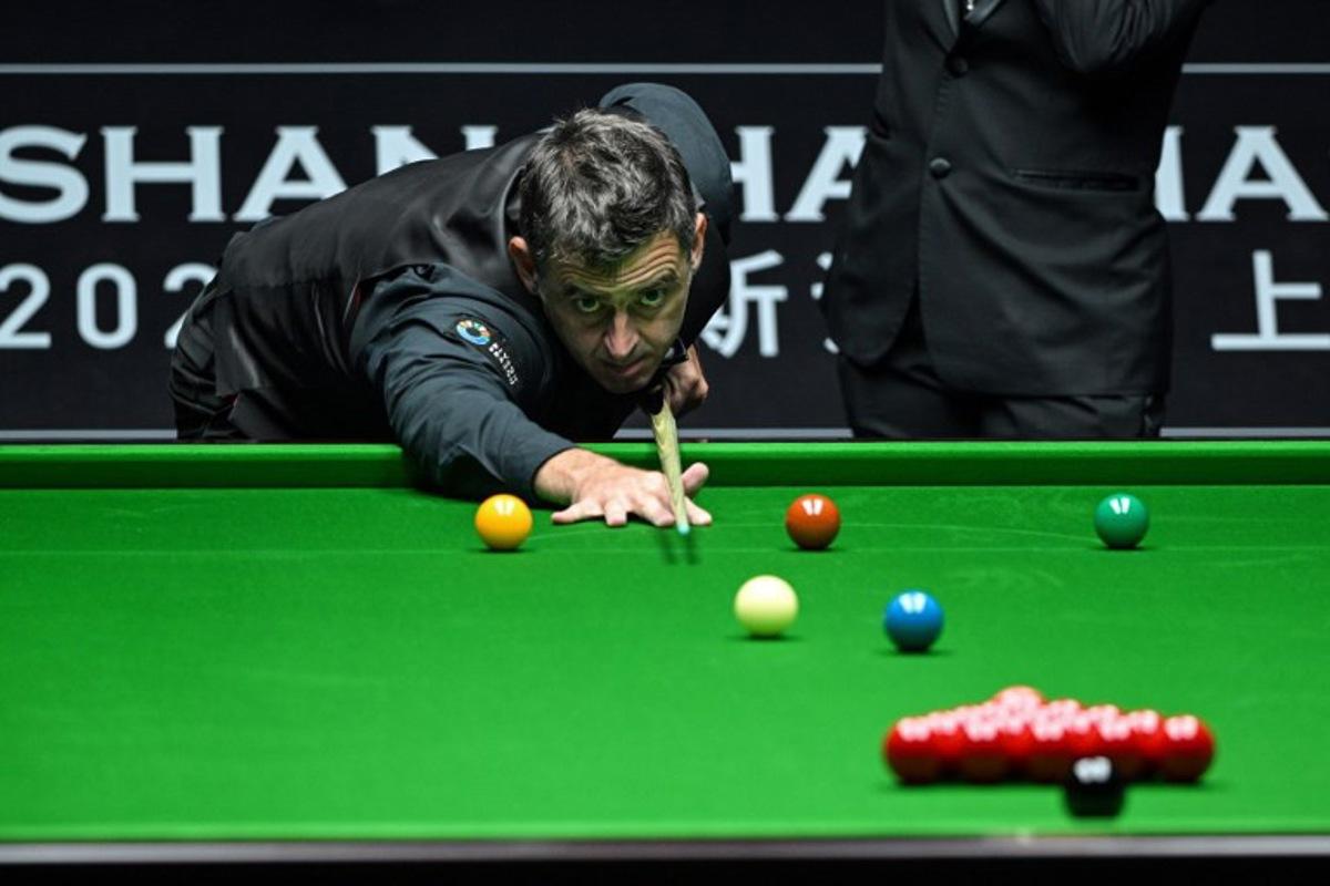 Britain's Ronnie O'Sullivan plays a shot during his match against Chinese Zhou Jinhao at the Shanghai Masters snooker tournament in Shanghai on July 16, 2024.  Hector RETAMAL / AFP