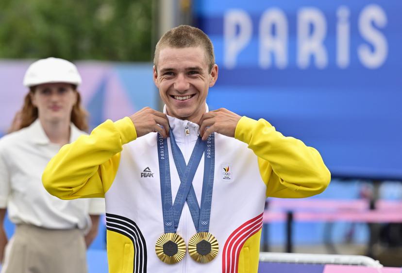 Two-time gold medal winner Belgian Remco Evenepoel celebrates with his medals during the podium ceremony after the men's road race at the Paris 2024 Olympic Games, on Saturday 03 August 2024 in Paris, France. The Games of the XXXIII Olympiad are taking place in Paris from 26 July to 11 August. The Belgian delegation counts 165 athletes competing in 21 sports. BELGA PHOTO DIRK WAEM