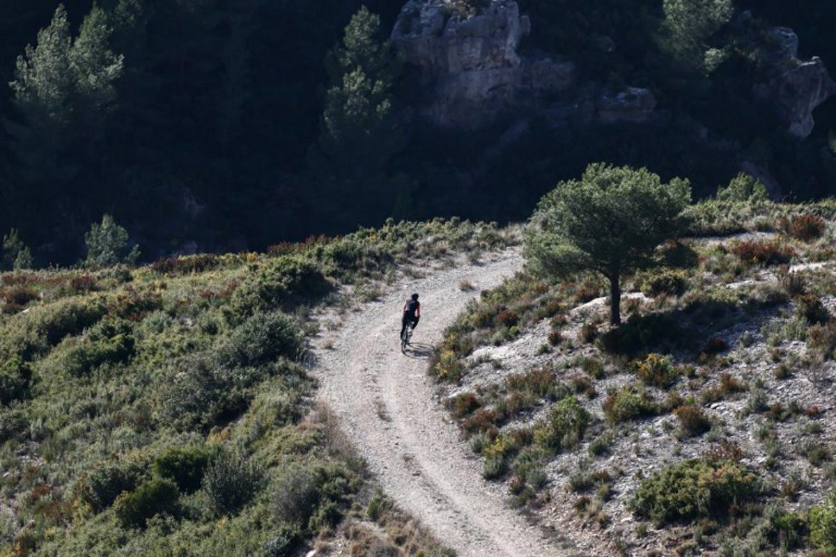 A man rides a bicycle in the hills above Marseille., on January 15, 2026, in Marseille.   Thibaud MORITZ / AFP