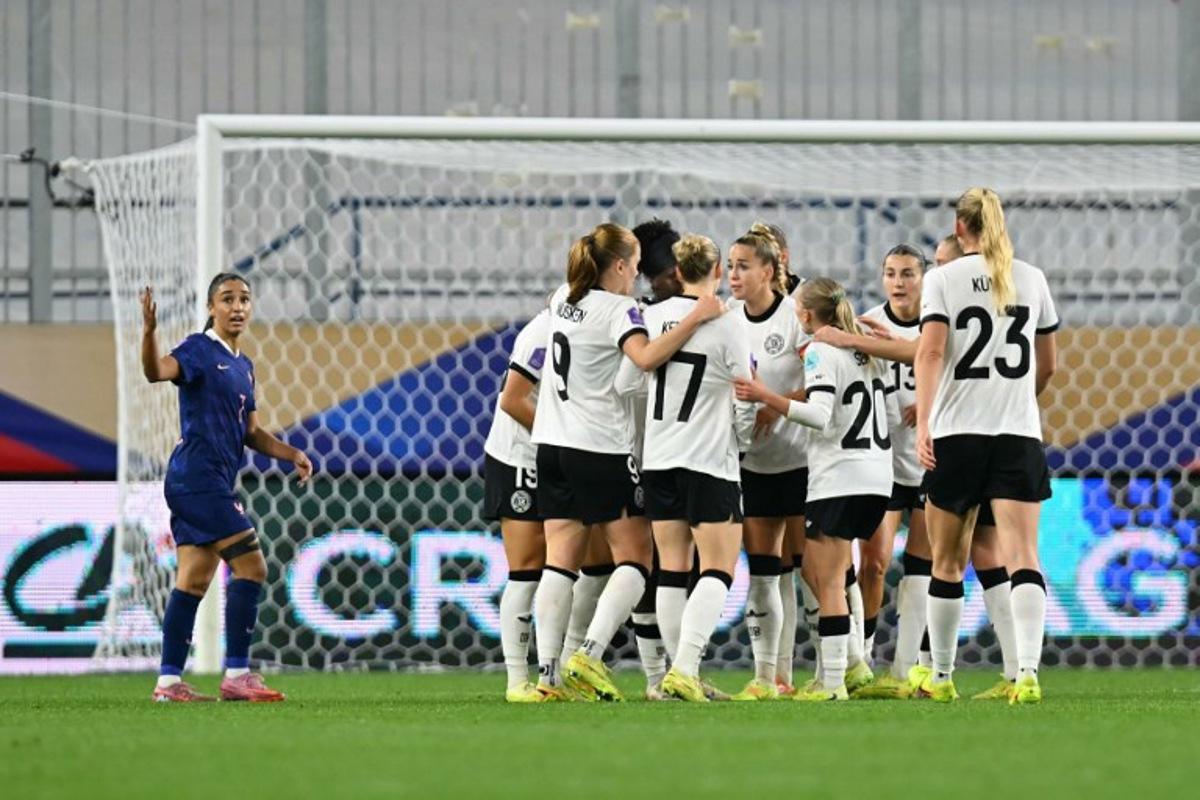 Germany's players celebrate after scoring Germany's first goal during the UEFA Women's Nations League semi-final football match between France and Germany at the Michel-d'Ornano Stadium in Caen, northwestern France, on October 28, 2025.  LOU BENOIST / AFP