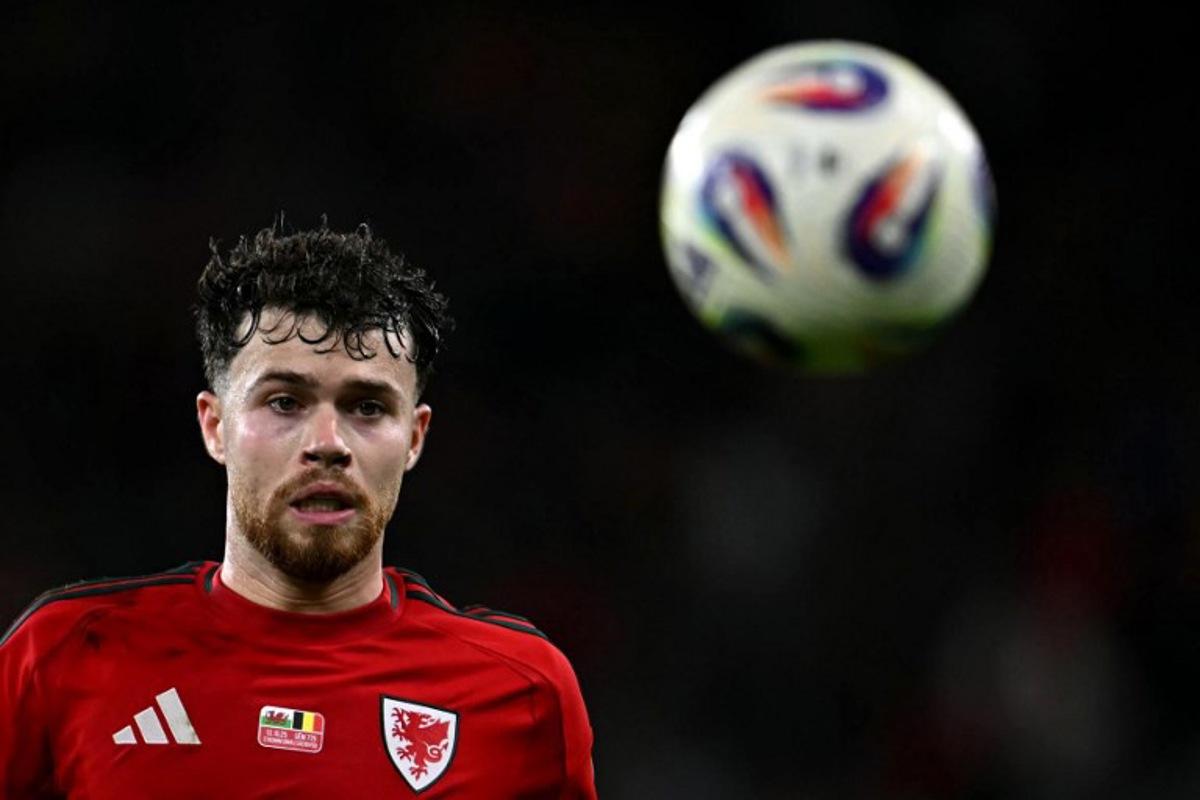 Wales' defender Neco Williams focuses on the ball during the 2026 World Cup Group J qualifier football match between Wales and Belgium, at Cardiff City Stadium, in Cardiff, on October 13, 2025.   Paul ELLIS / AFP