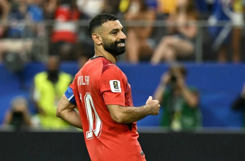 Egypt's forward #10 Mohamed Salah reacts after scoring in a penalty shoot-out during the 2026 World Cup round of 32 football match between Australia and Egypt at the Dallas Stadium in Arlington on July 3, 2026.   Paul ELLIS / AFP