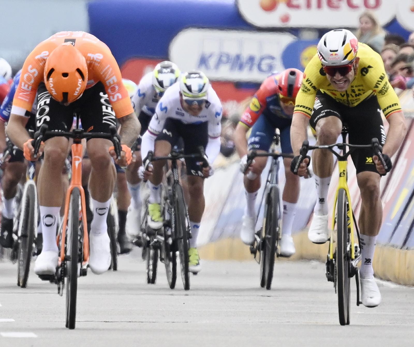 Italian Filippo Ganna of INEOS Grenadiers and Belgian Wout van Aert of Team Visma-Lease a Bike sprint to the finish of the men elite race of the 'Dwars Door Vlaanderen' cycling event, 184,6km from Roeselare to Waregem, Wednesday 01 April 2026. BELGA PHOTO TOM GOYVAERTS