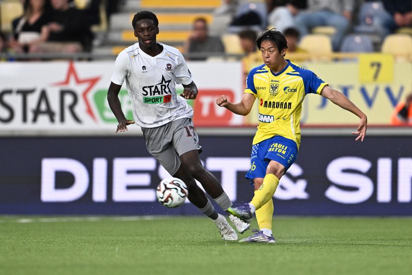 Dender's Noah Mbamba and STVV's Rihito Yamamoto fight for the ball during a soccer match between Sint-Truiden VV and FCV Dender EH, Friday 08 August 2025 in Sint-Truiden, on the day 3 of the 2025-2026 'Jupiler Pro League' first division of the Belgian championship. BELGA PHOTO JOHAN EYCKENS