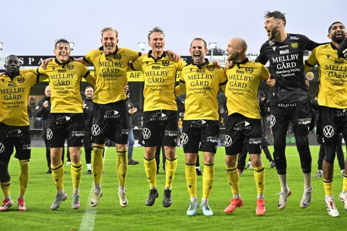 Mjallby AIF's players celebrate their victory after the Swedish football championship (Allsvenskan) football match between Mjallby AIF and IF Elfsborg at Strandvallen in Hallevik, near Mjallby, on October 4, 2025. 'I'm keeping the idea, I don't even dare to think about it': with four days left in the championship, Mjällby AIF coach Anders Torstensson wants to keep a cool head as his club could become Swedish football champions. Johan NILSSON / TT NEWS AGENCY / AFP