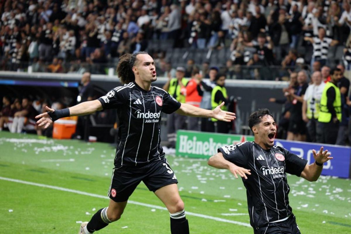 Frankfurt's Algerian midfielder #08 Fares Chaibi (R) and Frankfurt's Belgian defender #03 Arthur Theate celebrate during the UEFA Champions League league phase day 1 football match between Eintracht Frankfurt and Galatasaray in Frankfurt, western Germany on September 18, 2025.  Daniel ROLAND / AFP