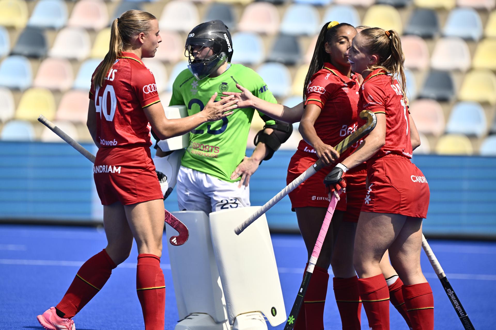 Belgium's Camille Belis, Belgium's Ambre Ballenghien and Belgium's Justine Rasir celebrate after a goal during a hockey game between Scotland and the Belgian national team Red Panthers, match 3/3 in the pool stage of the 2025 women's European championships, Wednesday 13 August 2025 in Monchengladbach, Germany.  BELGA PHOTO ERIC LALMAND
