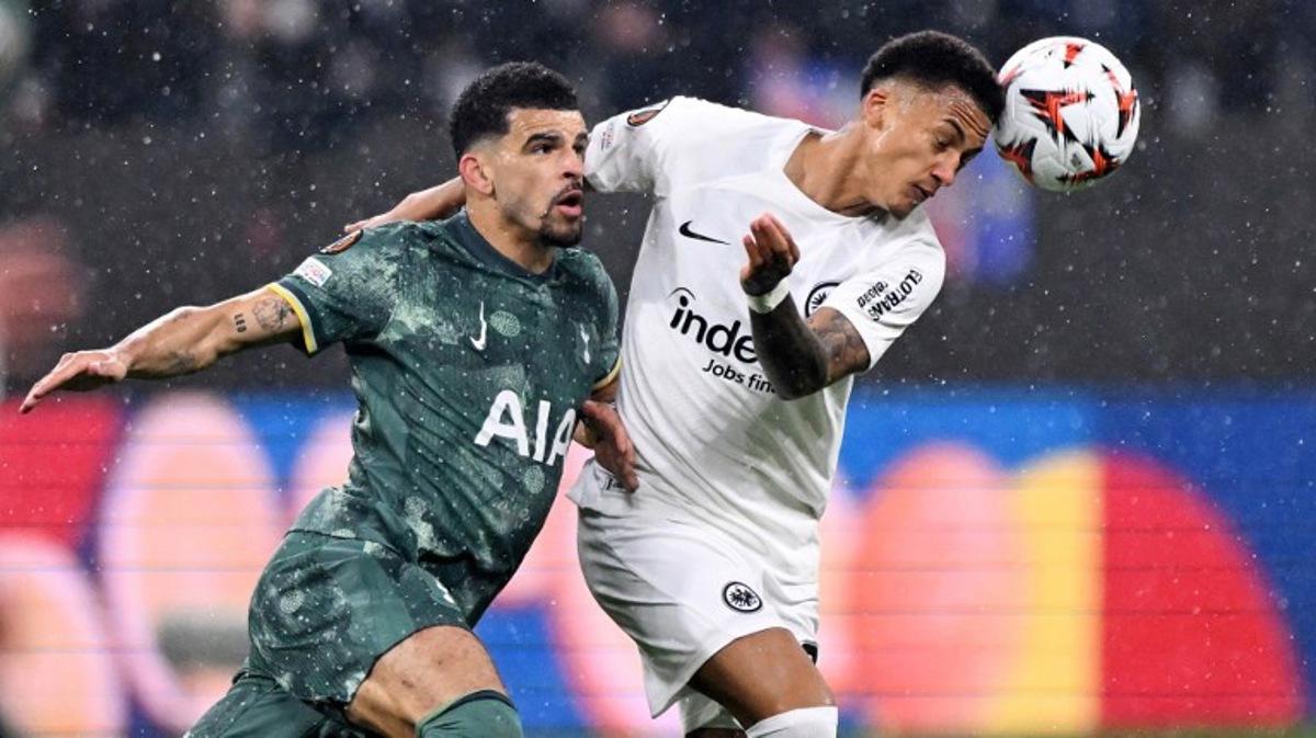 Tottenham Hotspur's English forward #19 Dominic Solanke (L) and Frankfurt's Brazilian defender #35 Tuta vie for the ball during the UEFA Europa League quarter-final second leg football match between Eintracht Frankfurt and Tottenham Hotspur in Frankfurt am Main, western Germany on April 17, 2025.  Kirill KUDRYAVTSEV / AFP