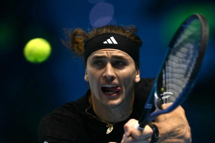 Germany's Alexander Zverev hits the ball during his match against USA's Ben Shelton at the ATP Finals tennis tournament in Turin on November 9, 2025.  Marco BERTORELLO / AFP