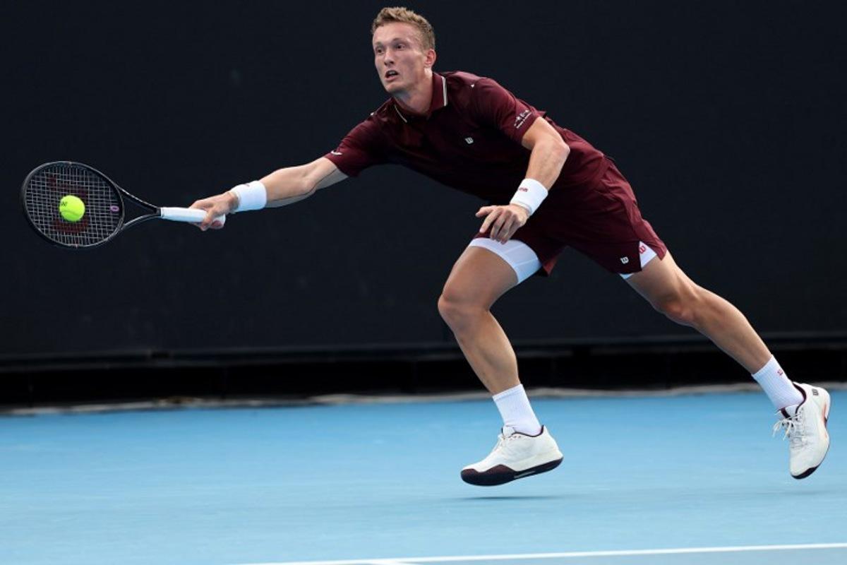 Czech Republic's Jiri Lehecka hits a return to France's Arthur Gea during their men's singles match on day two of the Australian Open tennis tournament in Melbourne on January 19, 2026.  Martin KEEP / AFP