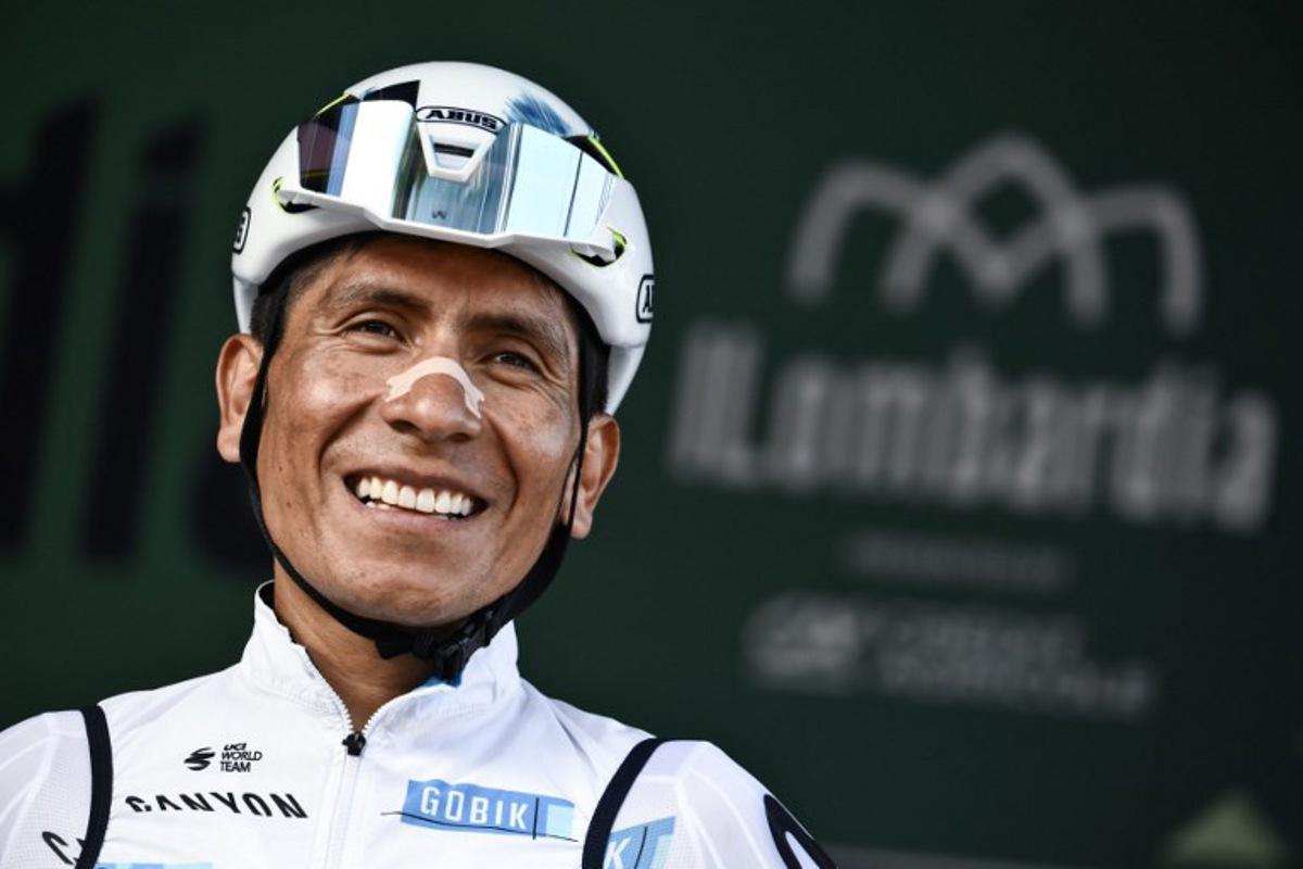 Movistar Team's Colombian riderNairo Quintana looks on from the sign-in podium ahead of the 119th edition of the Giro di Lombardia (Tour of Lombardy), a 238km cycling race from Como to Bergamo on October 11, 2025.  Marco BERTORELLO / AFP