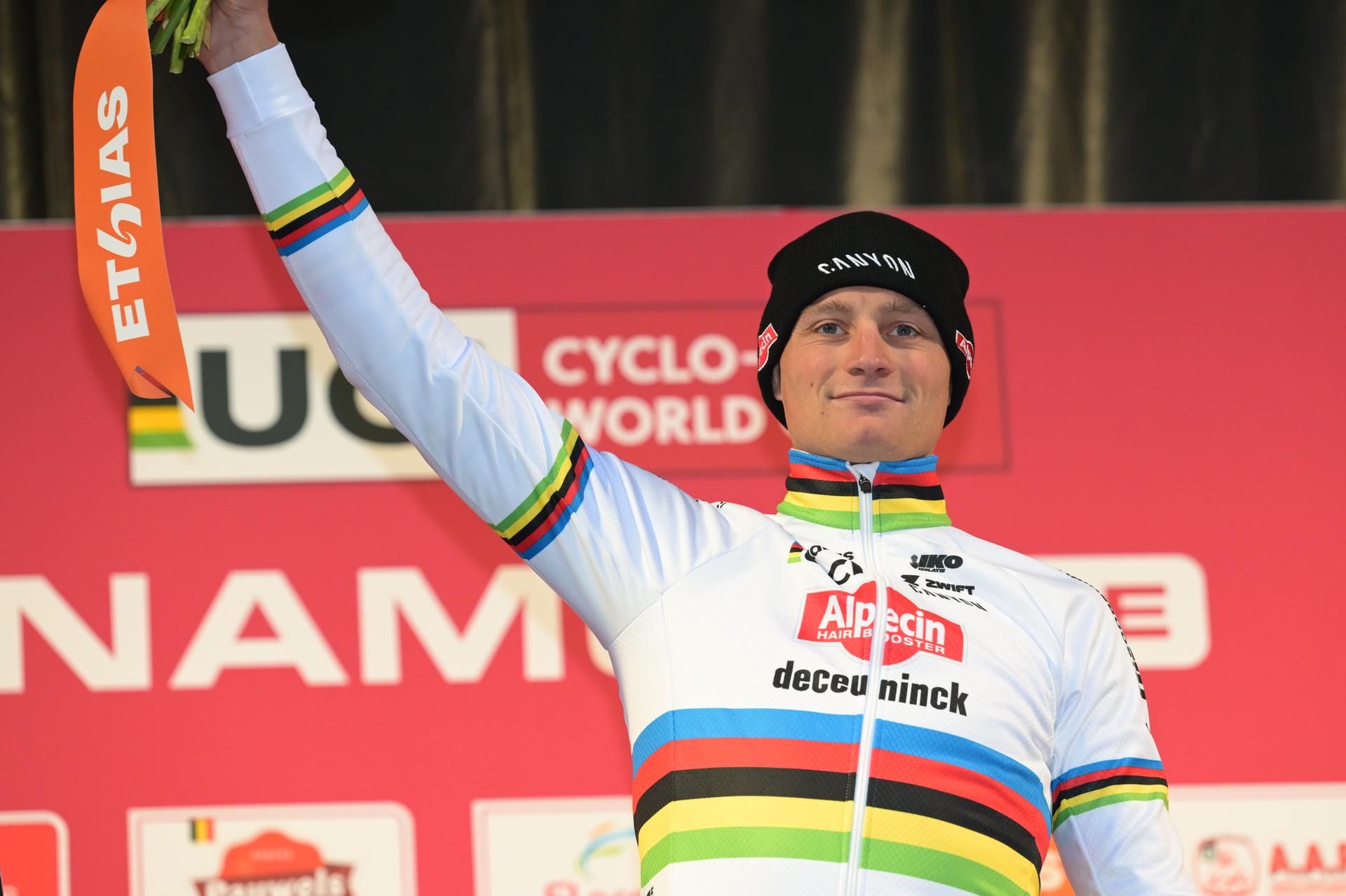 Dutch Mathieu Van Der Poel celebrates on the podium after winning the men's elite race of the Cyclocross World Cup, in Namur, Sunday 14 December 2025, stage 4 (out of 12) in the World Cup of the 2026-2027 season. BELGA PHOTO DAVID PINTENS