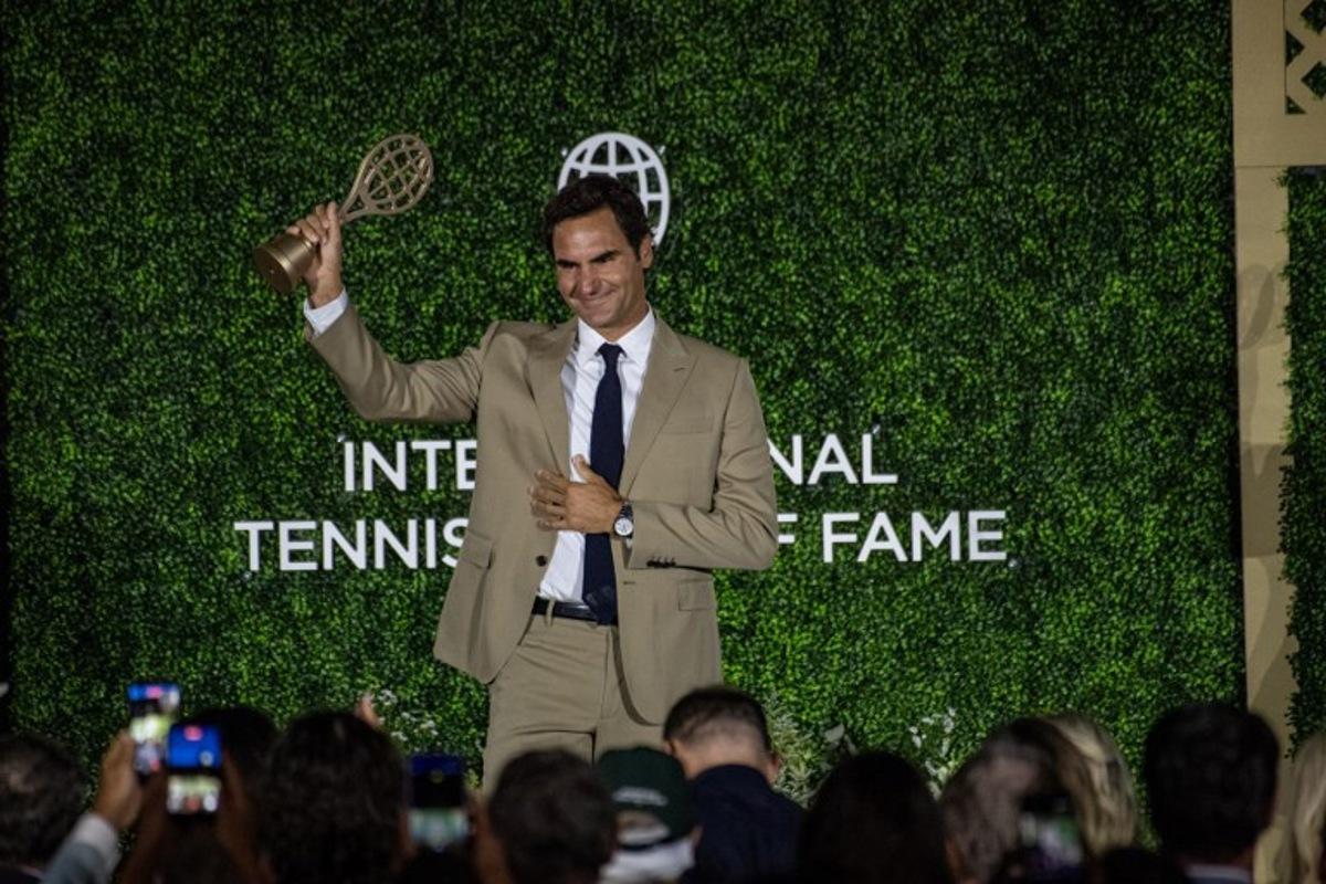 Swiss former tennis player Roger Federer accepts his induction into the International Tennis Hall of Fame during a ceremony in Newport, Rhode Island, on August 29, 2026.  Joseph Prezioso / AFP