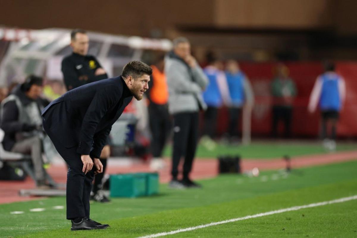 Monaco's Belgian head coach Sebastien Pocognoli looks on from the sideline during the French L1 football match between AS Monaco and Paris Saint-Germain (PSG) at the Stade Louis II in the Principality of Monaco on November 29, 2025.  Valery HACHE / AFP